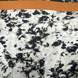 Floral Print Blouse with Black and Orange Trim